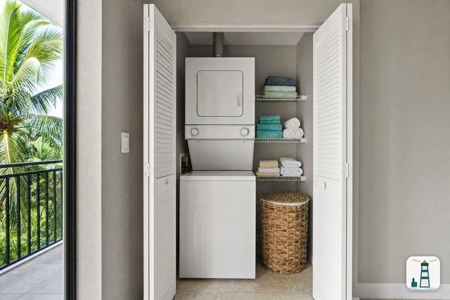 Stacked washer and dryer in a condo laundry closet