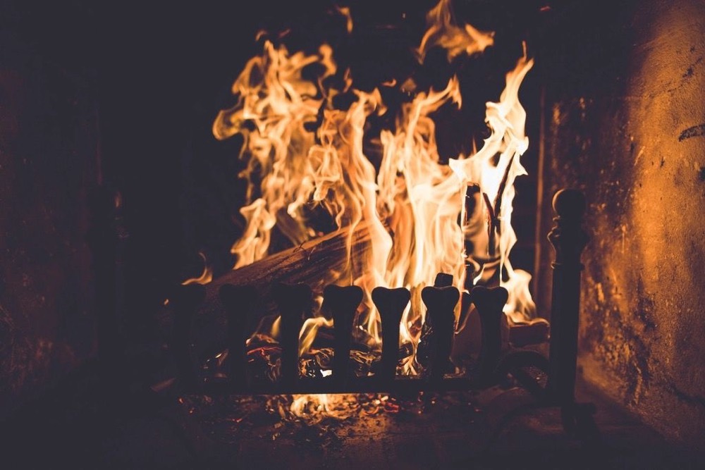 Living-room fireplace with a masonry surround — Pompano Beach · Broward County